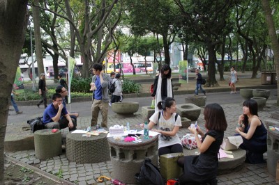 Group of people in the park, making stuff