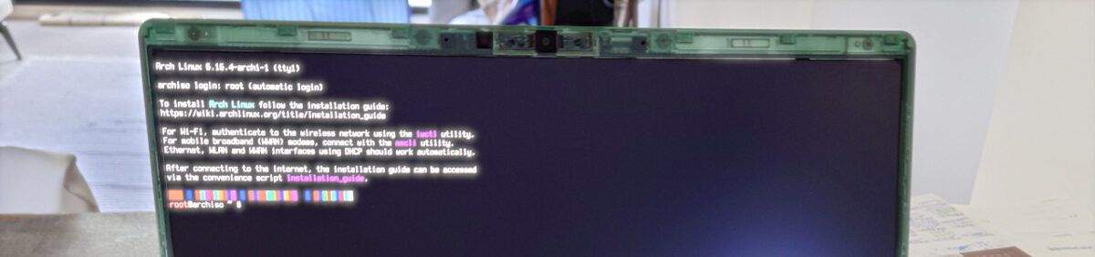 A laptop screen open at the Arch Linux installation media's shell.